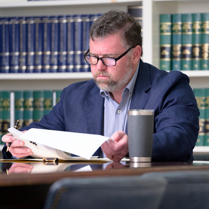 Tommy Morgan reviewing documents